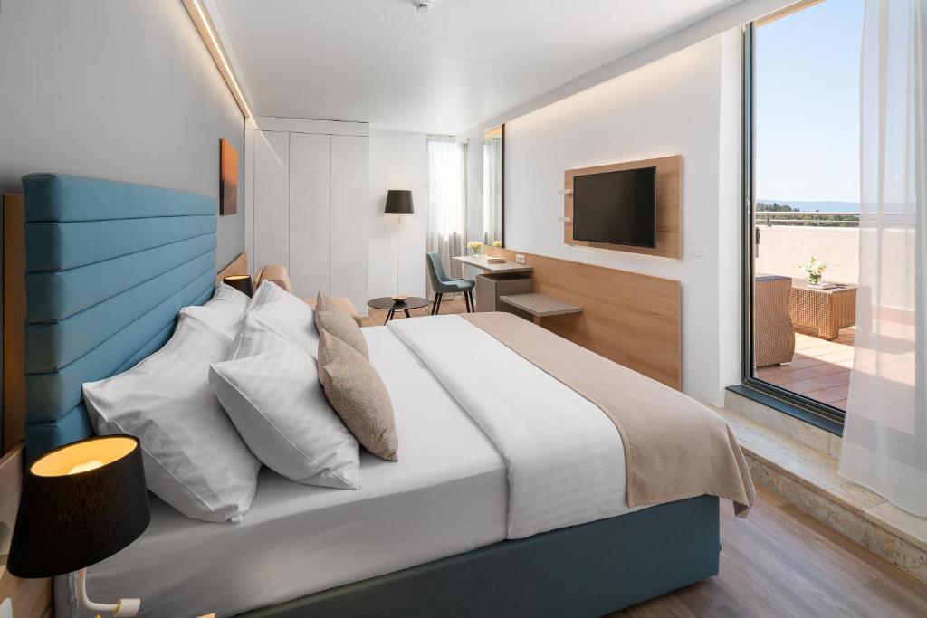 A television and/or entertainment centre at Valamar Meteor Hotel