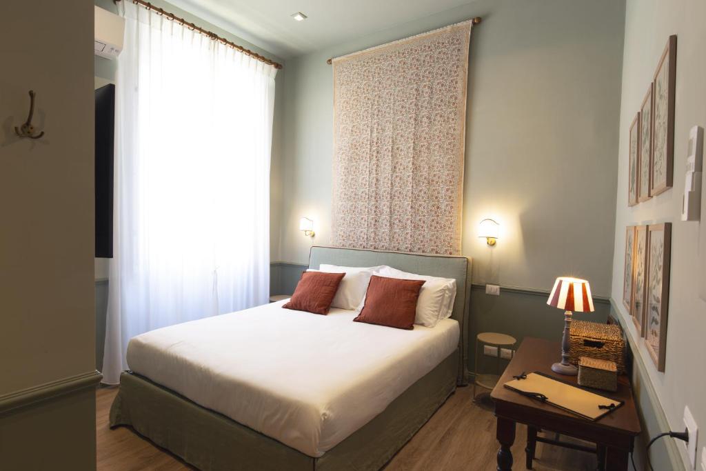 Postel nebo postele na pokoji v ubytování Hotel donna Francesca