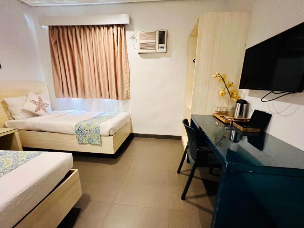 Postel nebo postele na pokoji v ubytování Treetop Suites