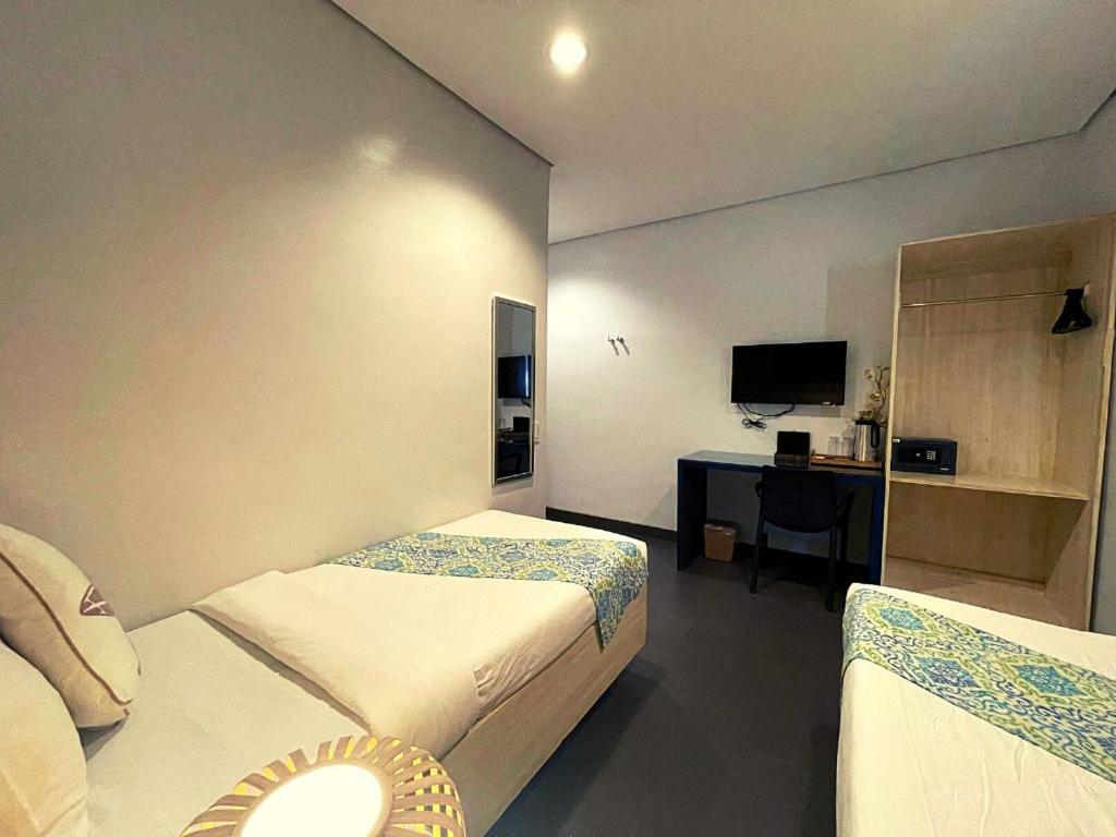 Postel nebo postele na pokoji v ubytování Treetop Suites