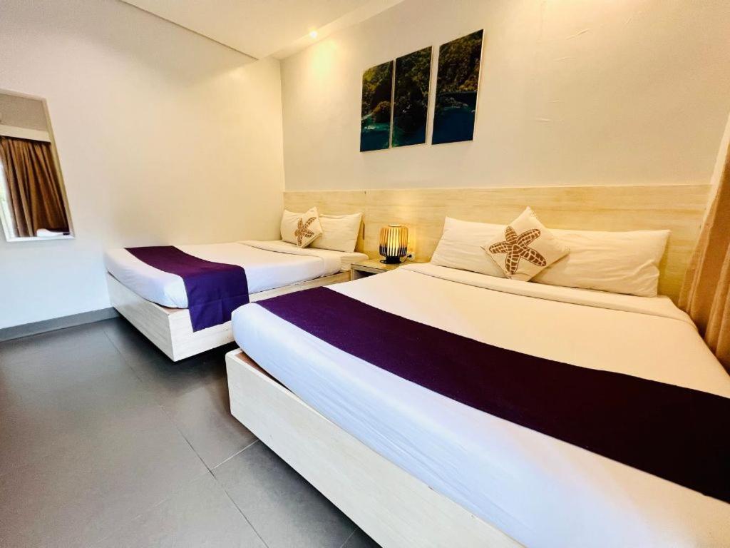 Postel nebo postele na pokoji v ubytování Treetop Suites