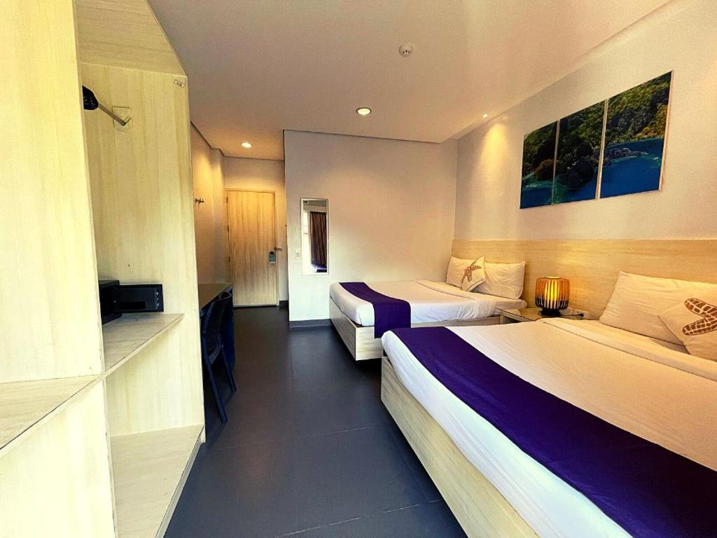 Postel nebo postele na pokoji v ubytování Treetop Suites
