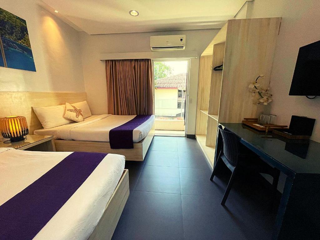 Postel nebo postele na pokoji v ubytování Treetop Suites