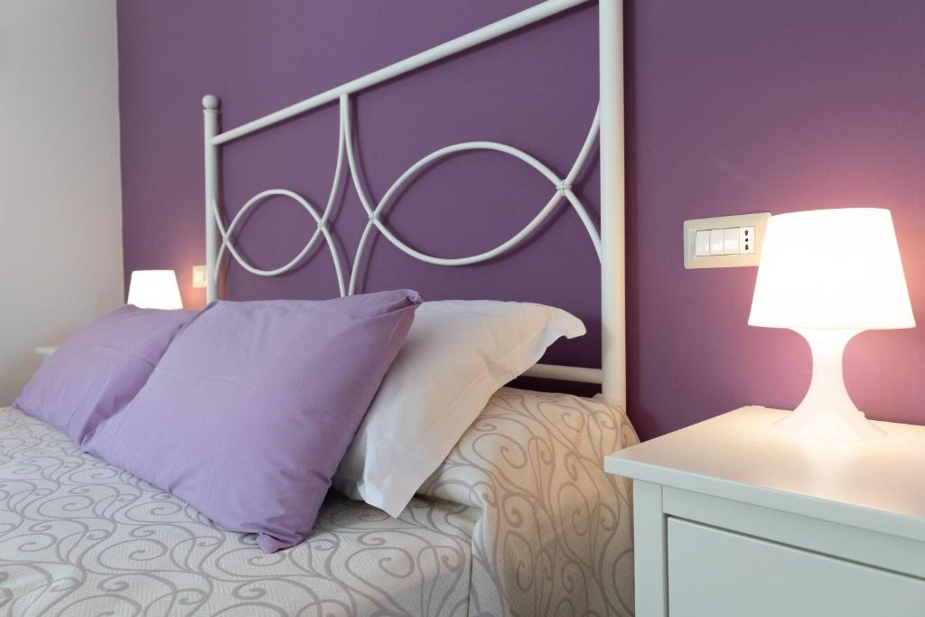 Postel nebo postele na pokoji v ubytování Hotel Residence Il Porto