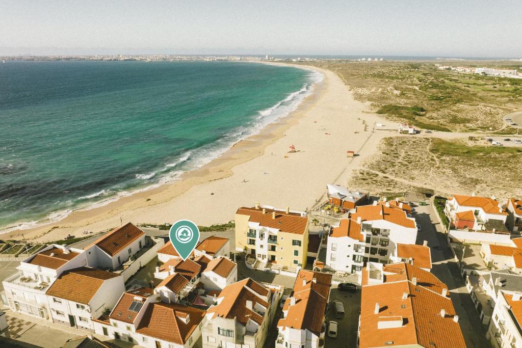 an aerial view of a beach with buildings and the ocean at Best Houses 65 - Sea & Surf House Consolação in Consolacao