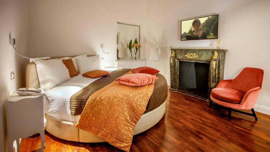 Postel nebo postele na pokoji v ubytování Hotel Del Corso