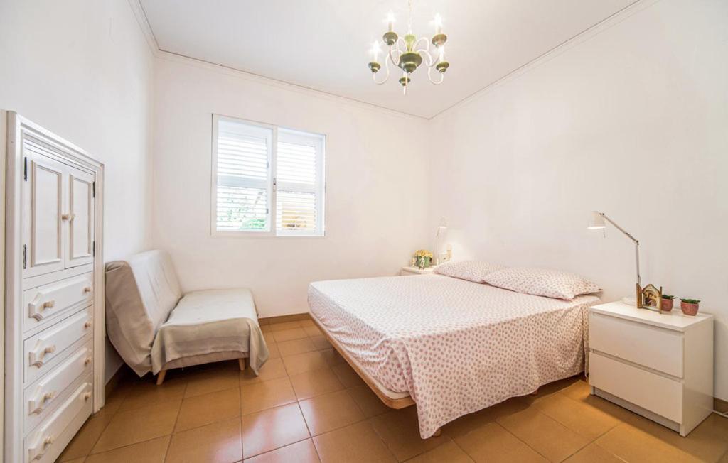 Postel nebo postele na pokoji v ubytování Agradable Villa junto al mar con piscina