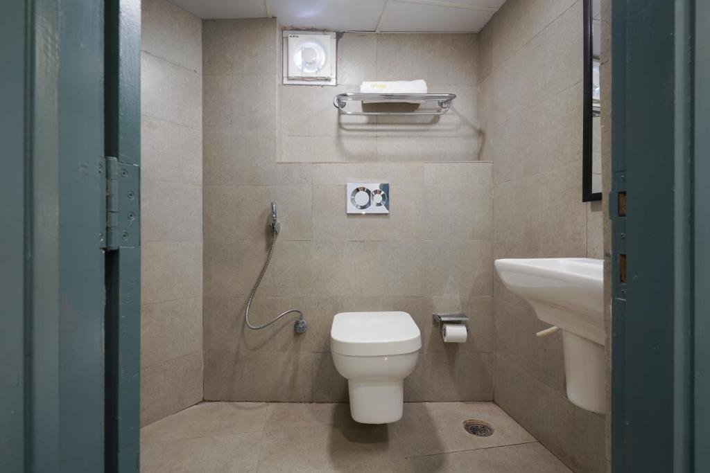Koupelna v ubytování Uptown Hotel