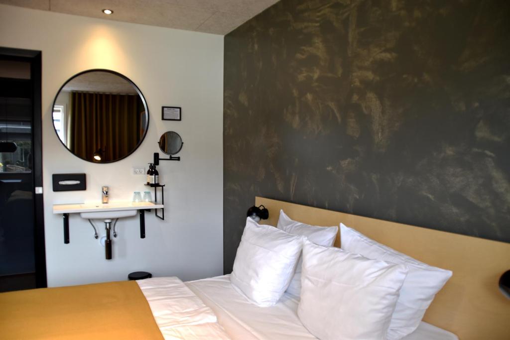 Postel nebo postele na pokoji v ubytování Fjordgaarden - Spa - Hotel - Konference