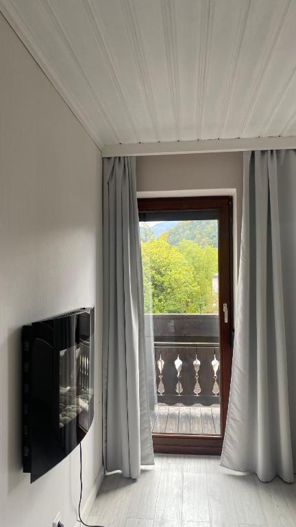 Televízia a/alebo spoločenská miestnosť v ubytovaní Bad Ischl - Central & Quiet Apartment