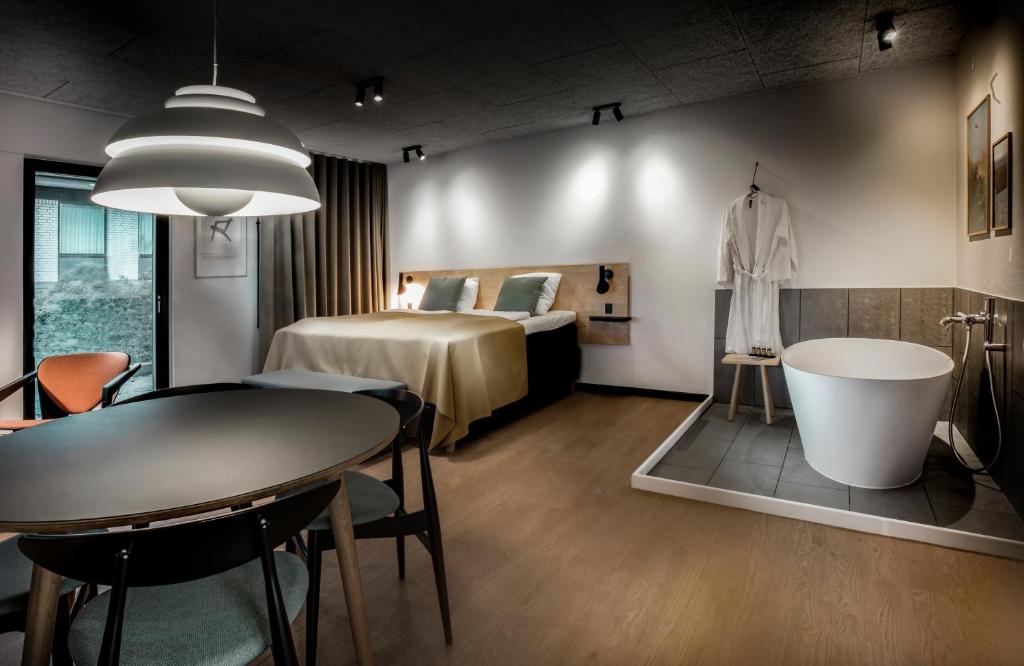 Postel nebo postele na pokoji v ubytování Fjordgaarden - Spa - Hotel - Konference