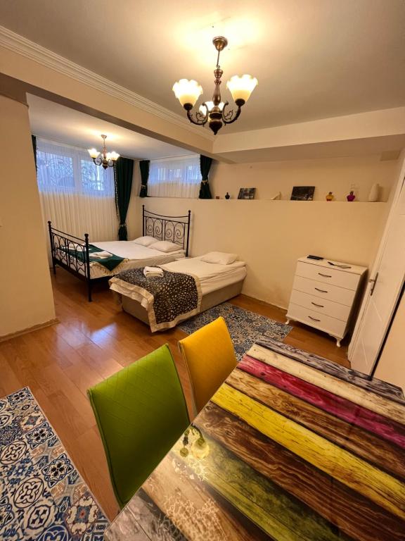 a living room with two beds and a rug at Stone Garden Apart in Istanbul