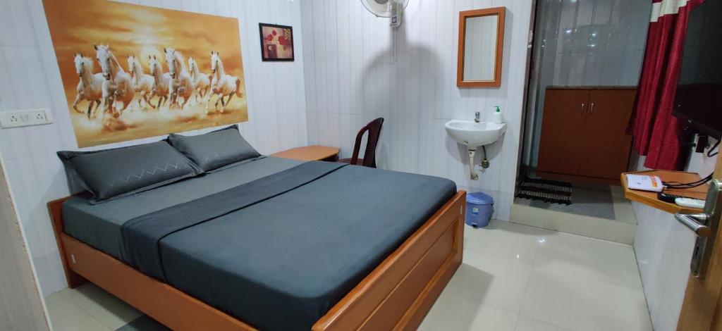 Postel nebo postele na pokoji v ubytování S.S.K RESIDENCY