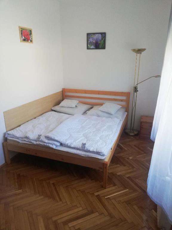 Łóżko lub łóżka w pokoju w obiekcie Total Relax Apartmanház