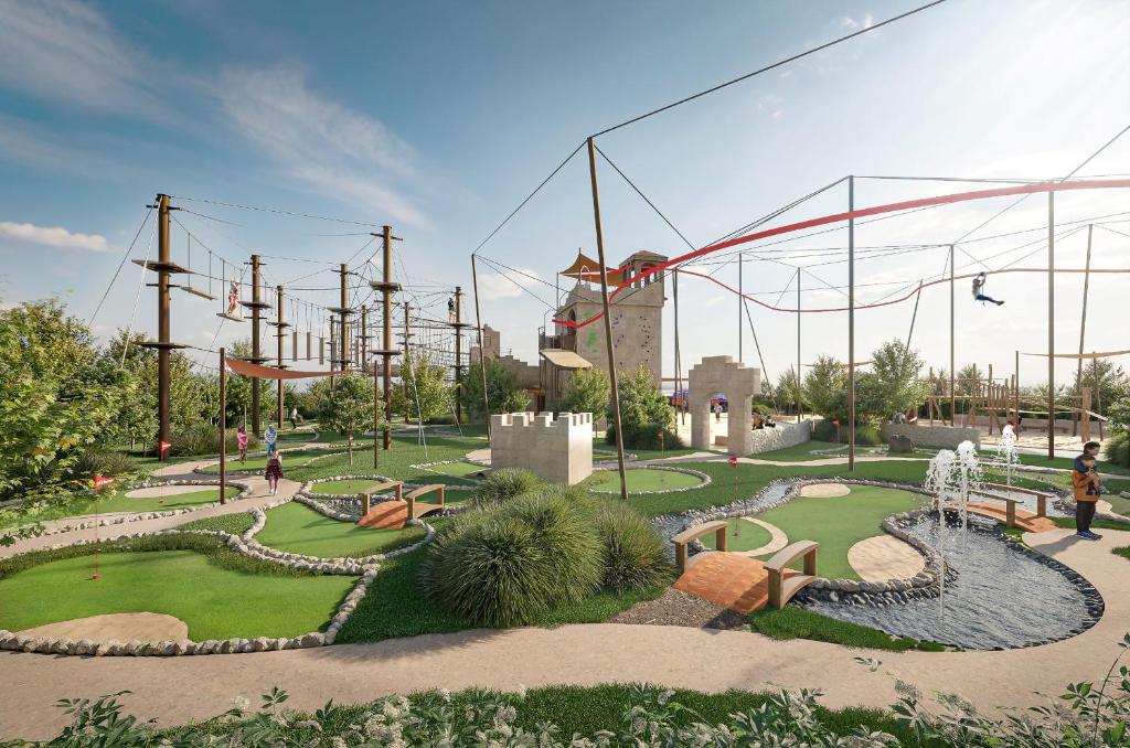 a ride in a park with a roller coaster at City of Dreams Mediterranean - Integrated Resort, Casino & Entertainment in Limassol