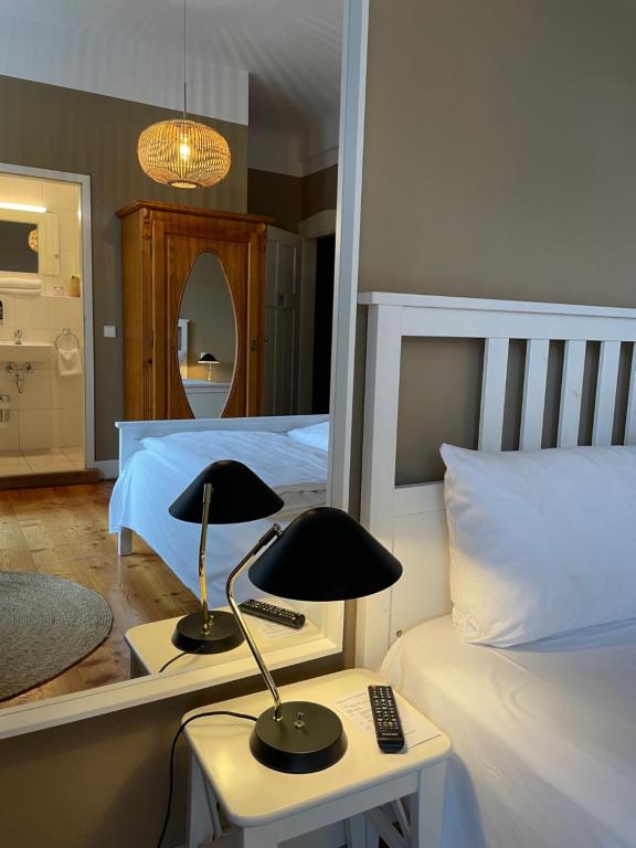 Postel nebo postele na pokoji v ubytování AUERSTEIN-Hotels auerstein & auerstein-mono