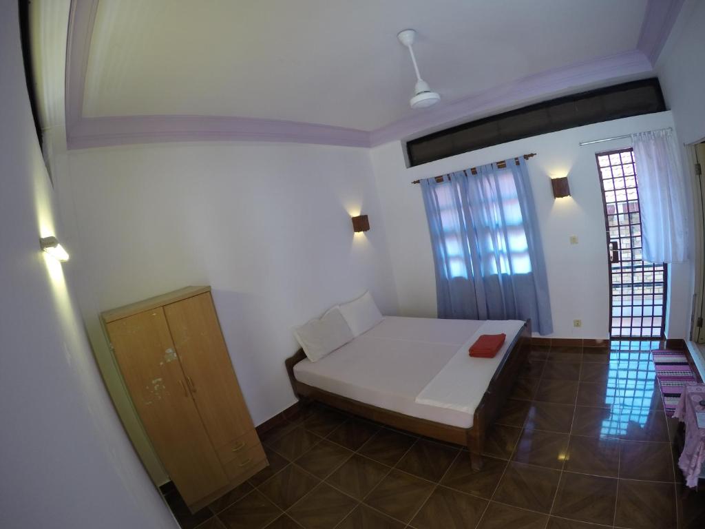 Postel nebo postele na pokoji v ubytování Smiley's Guesthouse
