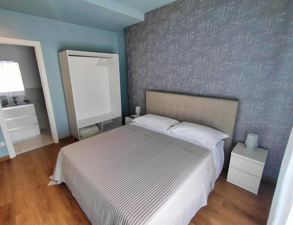 Łóżko lub łóżka w pokoju w obiekcie Flavi Home B&B