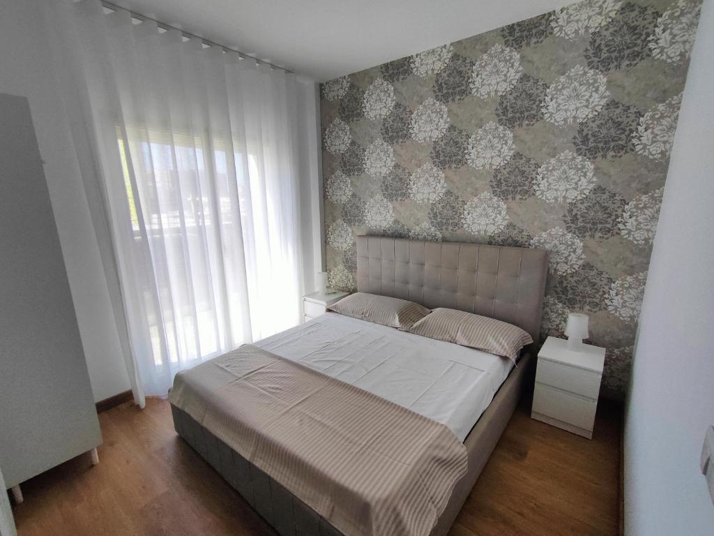 Łóżko lub łóżka w pokoju w obiekcie Flavi Home B&B