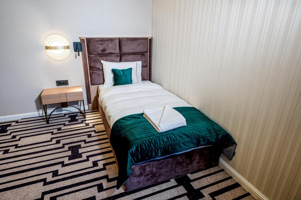 Postel nebo postele na pokoji v ubytování Hotel Carolin