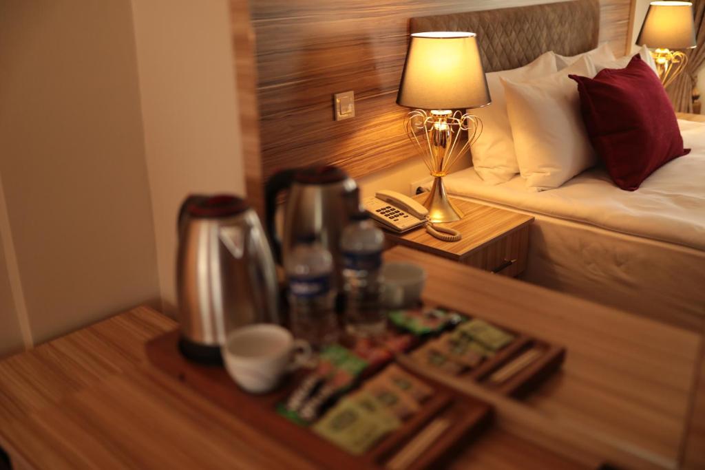 A bed or beds in a room at Gülec Konak Hotel