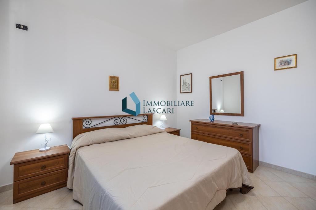 Łóżko lub łóżka w pokoju w obiekcie Villa Siragusa con piscina condominiale
