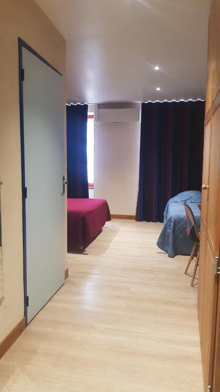 Postel nebo postele na pokoji v ubytování Le Bilboquet