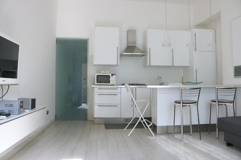 Kuchyň nebo kuchyňský kout v ubytování Design Canal Apartment