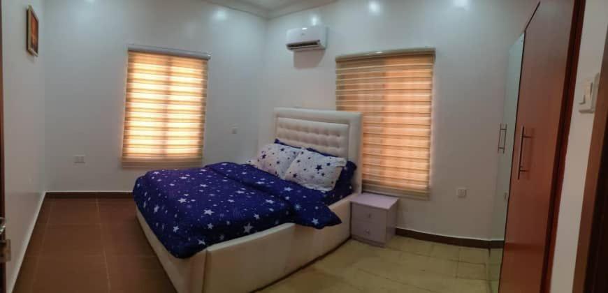 Krevet ili kreveti u jedinici u okviru objekta One Bedroom In Wuye Abuja