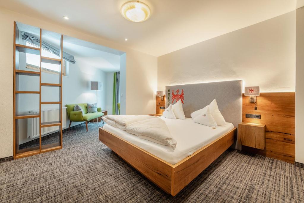 Posteľ alebo postele v izbe v ubytovaní Kräuterhotel Hochzillertal