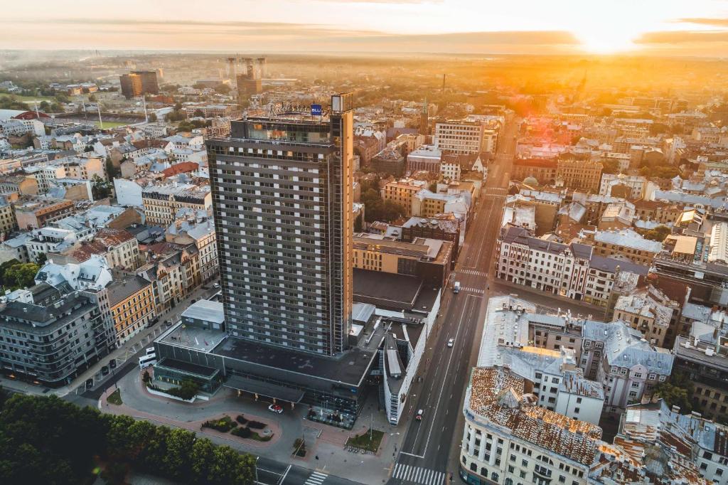 an aerial view of a city with a tall building at Radisson Blu Latvija Conference & Spa Hotel, Riga in Rīga