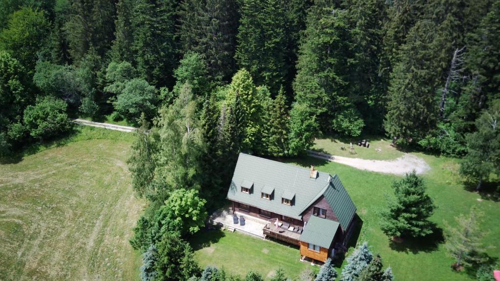 an aerial view of a house in the middle of a forest at Chata Vrch Varta in Ružomberok