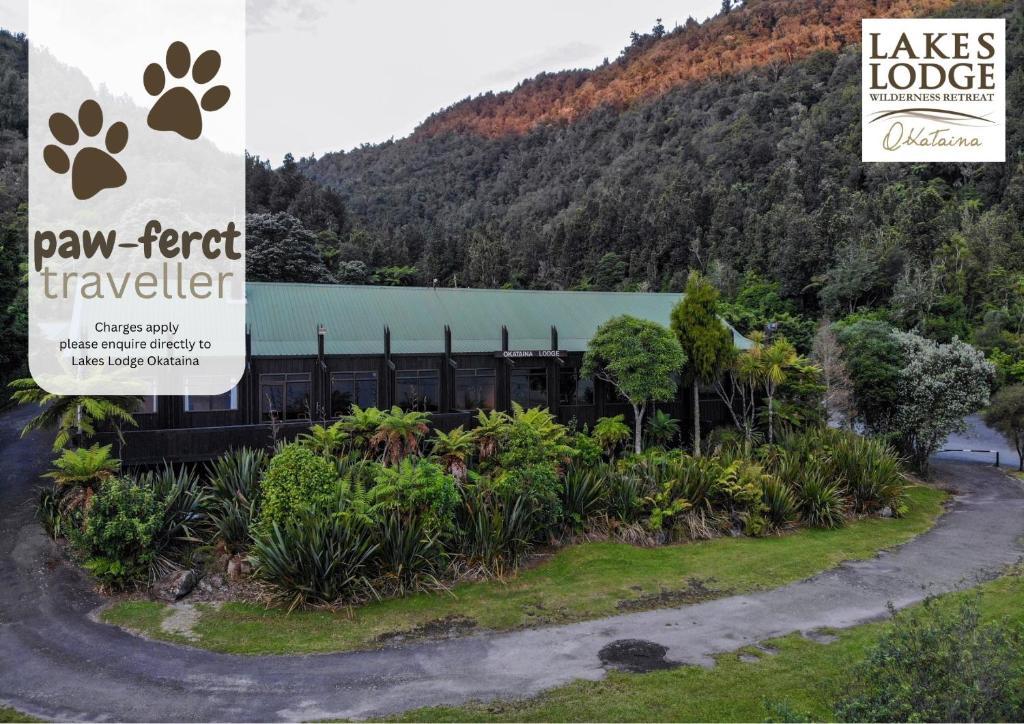 a sign for a paw friend traveler in front of a building at Lakes Lodge Okataina in Rotorua