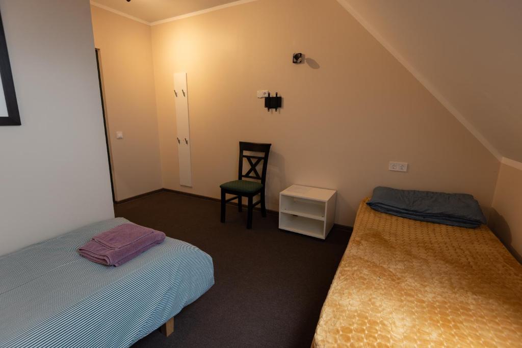 Postel nebo postele na pokoji v ubytování Aiakeskuse hostel