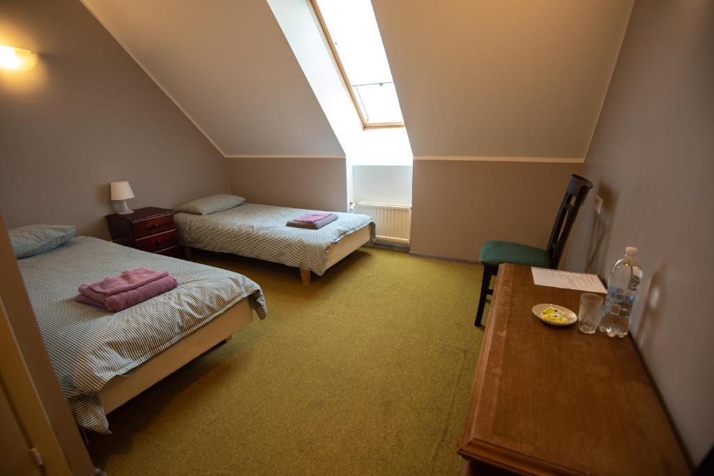 Postel nebo postele na pokoji v ubytování Aiakeskuse hostel