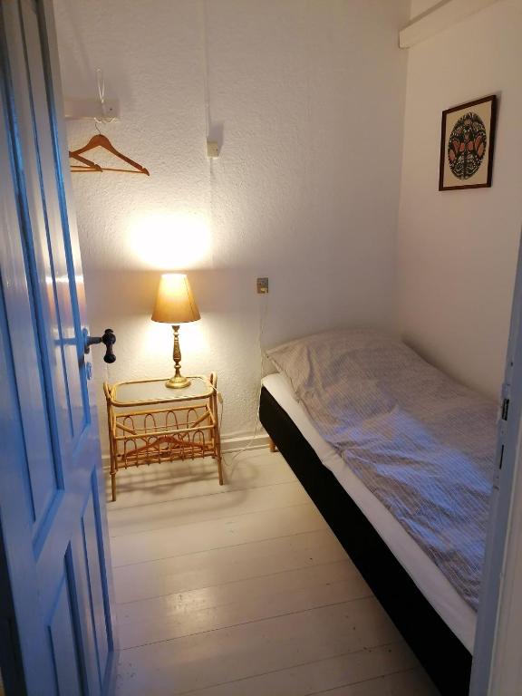 Postel nebo postele na pokoji v ubytování Skovhuset