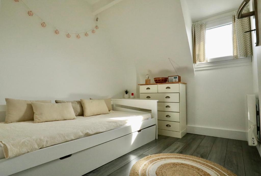 Posteľ alebo postele v izbe v ubytovaní Appartement de l'Hippodrome avec deux chambres