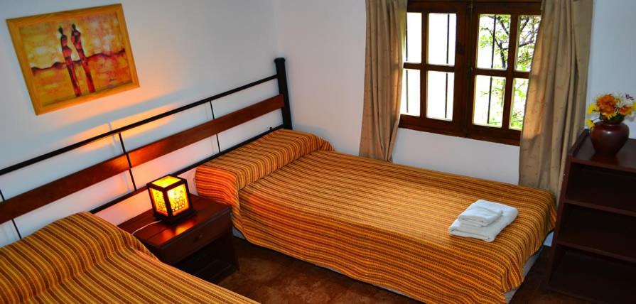 Postel nebo postele na pokoji v ubytování Cabañas San Lorenzo