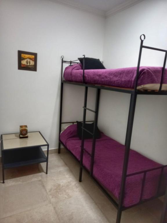 Postel nebo postele na pokoji v ubytování Cabañas San Lorenzo
