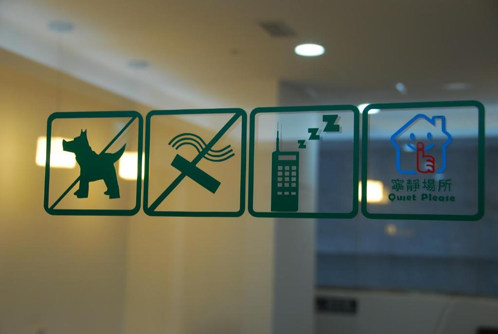 a close up of a sign on a window at Inn Cube - Ximen in Taipei
