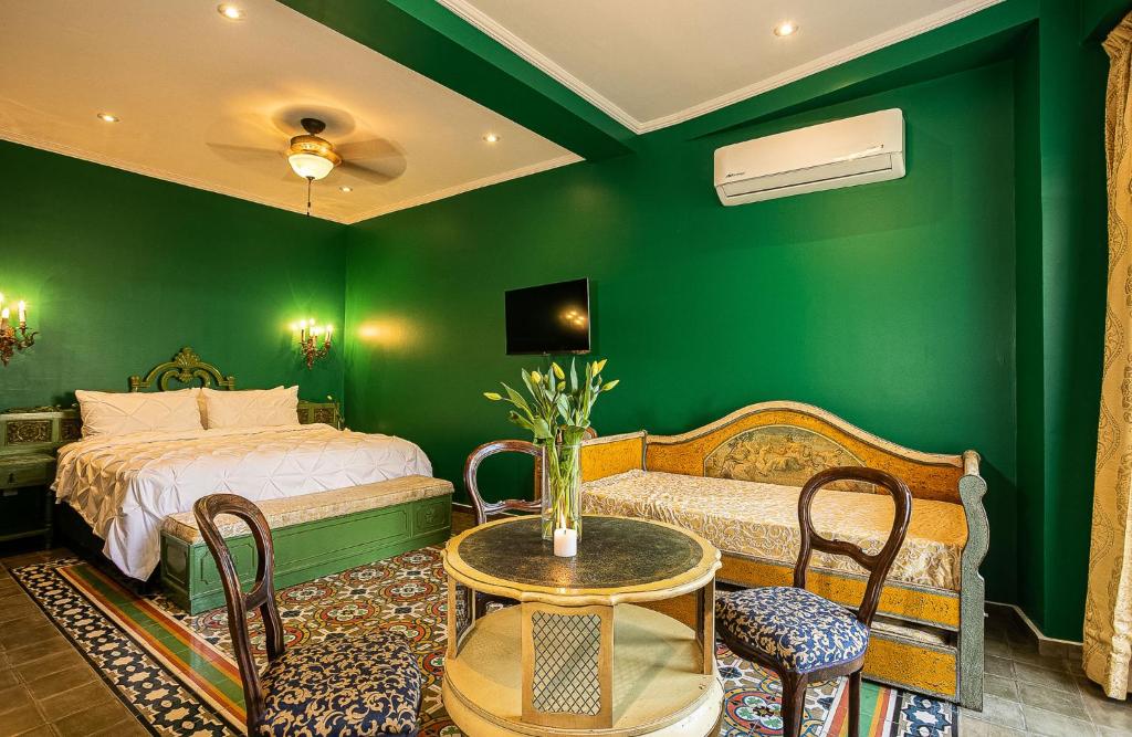 Postel nebo postele na pokoji v ubytování Hotel Boutique Rivera Del Rio