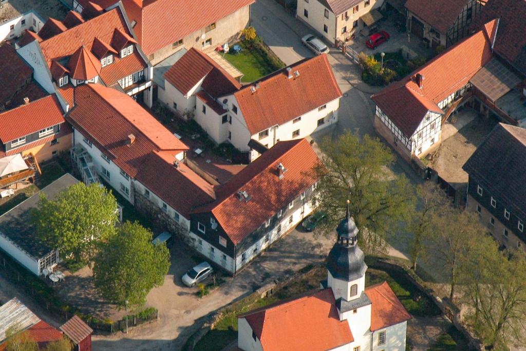 an overhead view of a church with orange roofs at Landhotel &amp; Restaurant Kains Hof in Uhlstädt