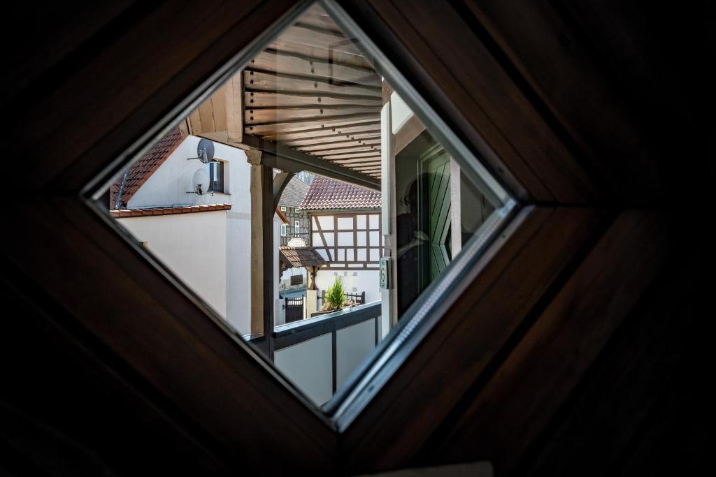 an attic view of a house through a window at Landhotel &amp; Restaurant Kains Hof in Uhlstädt
