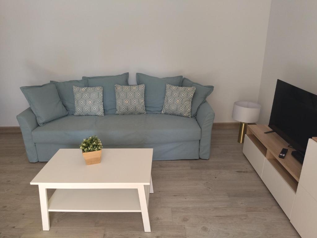 Televízia a/alebo spoločenská miestnosť v ubytovaní Las Olas 206