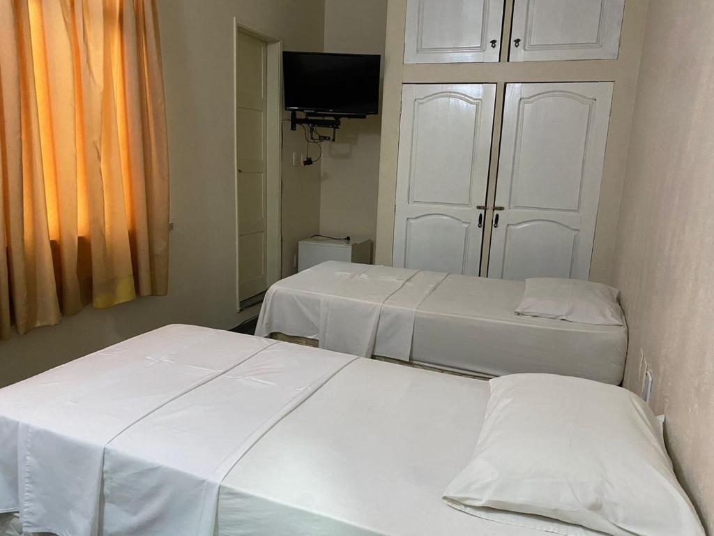 Postel nebo postele na pokoji v ubytování Hotel Central Gold