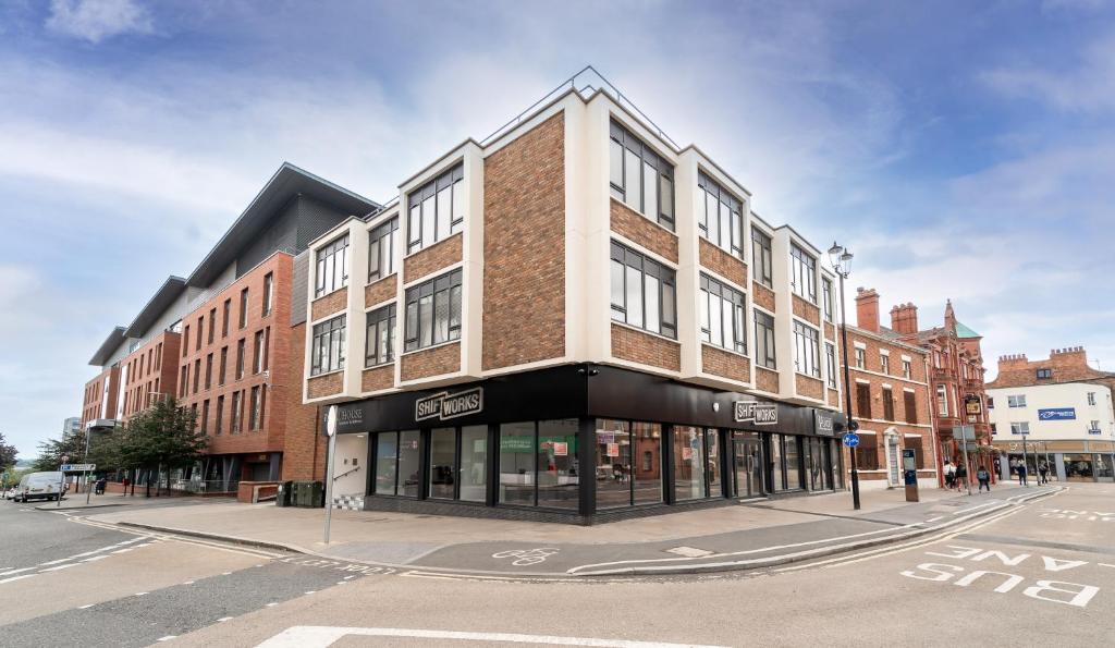 a building on the corner of a city street at Royal House Luxury Apartments - Chester in Chester