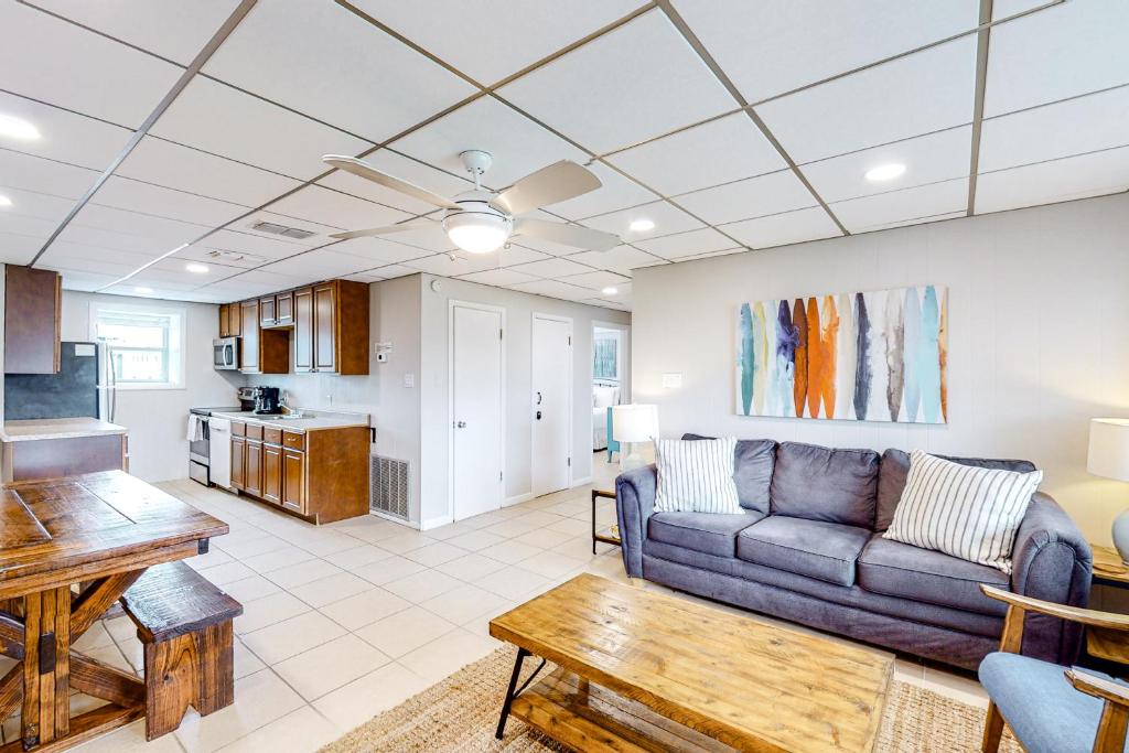 a living room with a couch and a table at Unit 32, Island Retreat Resort in Port Aransas