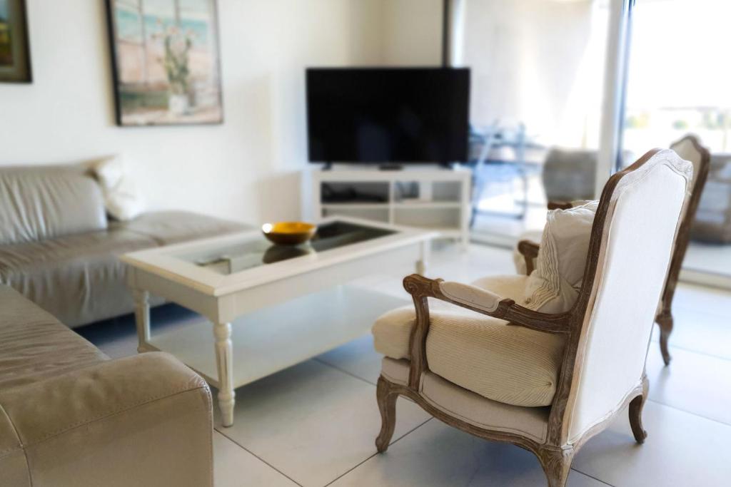 TV i/ili multimedijalni sistem u objektu Residenza Vivian Deluxe Apartments
