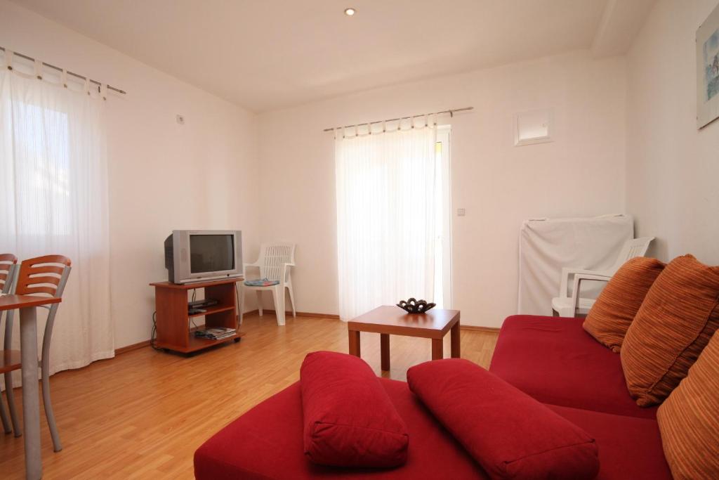 Televízia a/alebo spoločenská miestnosť v ubytovaní Apartment Preko 8384a