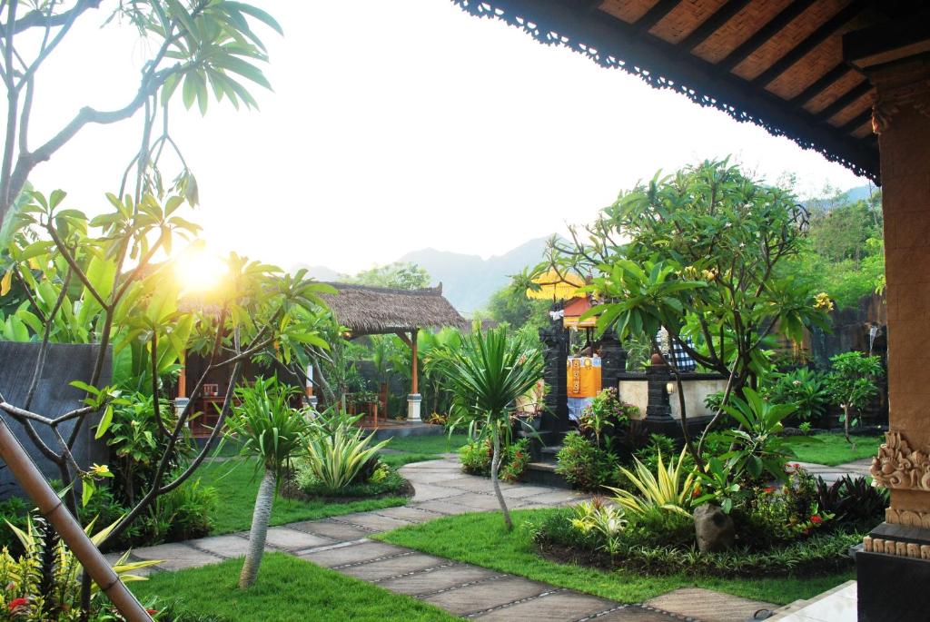 a view of a garden from a house at Trijaya Guest House Pemuteran in Pemuteran